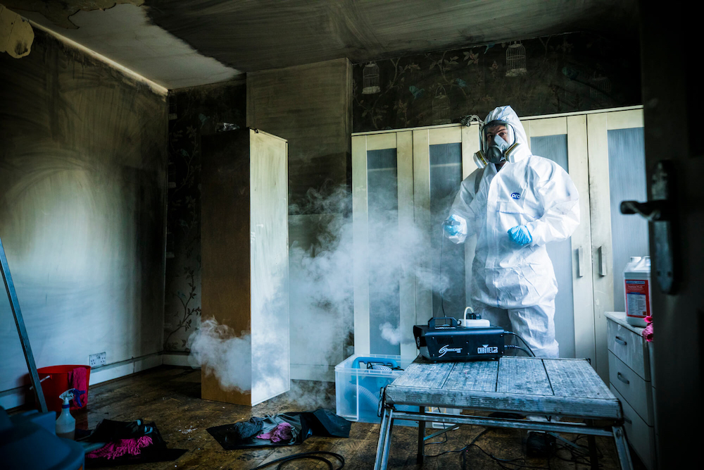 Fire remediation specialist treating a room