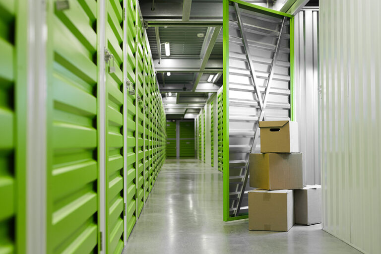 pack out services bringing boxes to a storage unit